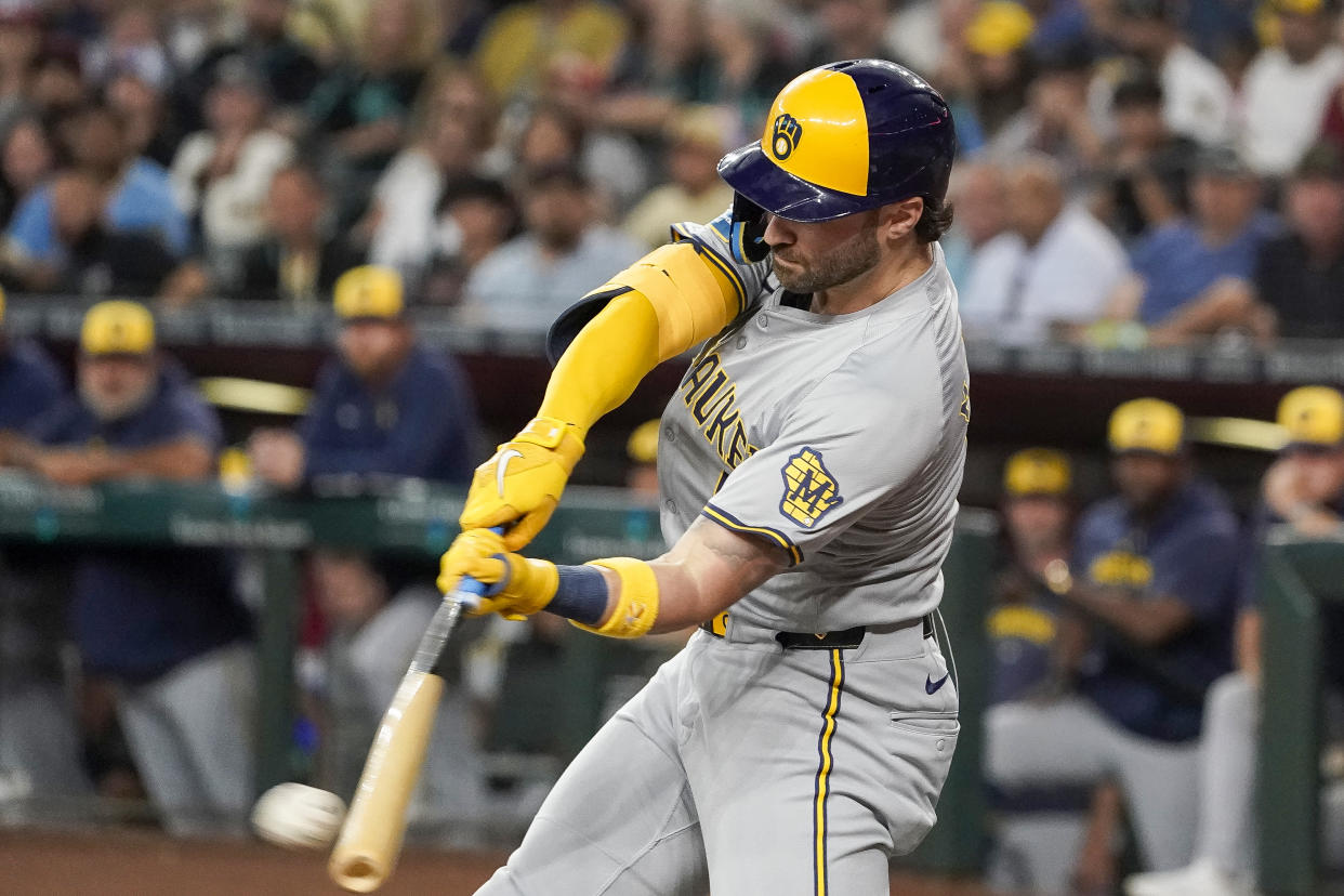 Milwaukee Brewers' Garrett Mitchell hits a single against the Arizona Diamondbacks during the first inning of a baseball game, Saturday, Sept. 14, 2024, in Phoenix. (AP Photo/Darryl Webb)