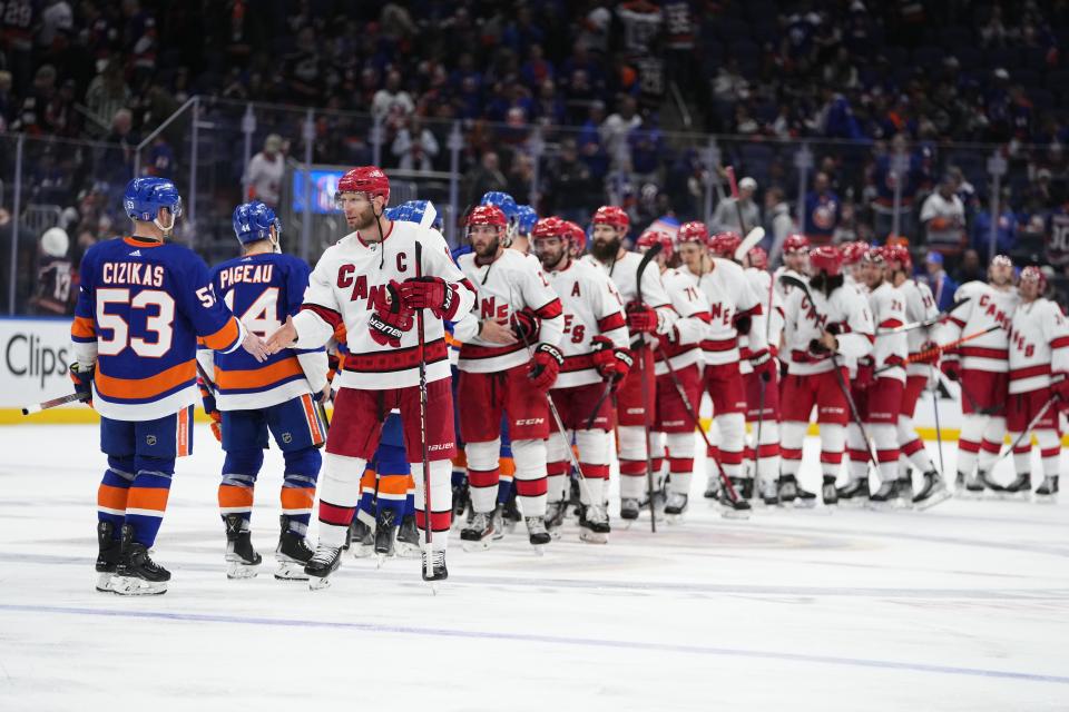 Carolina Hurricanes' Jordan Staal (11) shakes hands with New York Islanders' Casey Cizikas (53) after Game 6 of an NHL hockey Stanley Cup first-round playoff series Friday, April 28, 2023, in Elmont, N.Y. The Hurricanes won 2-1, taking the series. (AP Photo/Frank Franklin II)