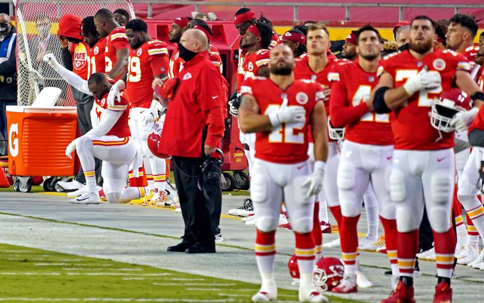 Alex Okafor kneels for the national anthem - USA TODAY Sports