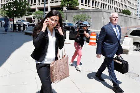 Lawyers Eric Dubelier and Katherine Seikaly leave U.S. District Court, following the arraignment of Concord Management and Consulting LLC, one of three entities and 13 Russian individuals indicted in an alleged criminal and espionage conspiracy to tamper in the 2016 U.S. presidential election, in Washington, U.S., May 9, 2018. REUTERS/Yuri Gripas