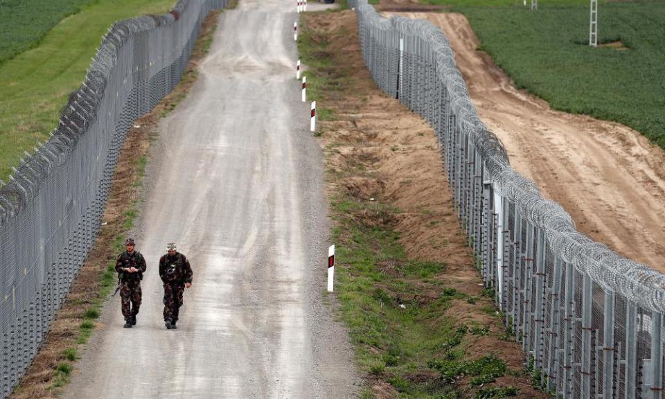 Hungarian soldiers patrol the Hungarian-Serbian border.