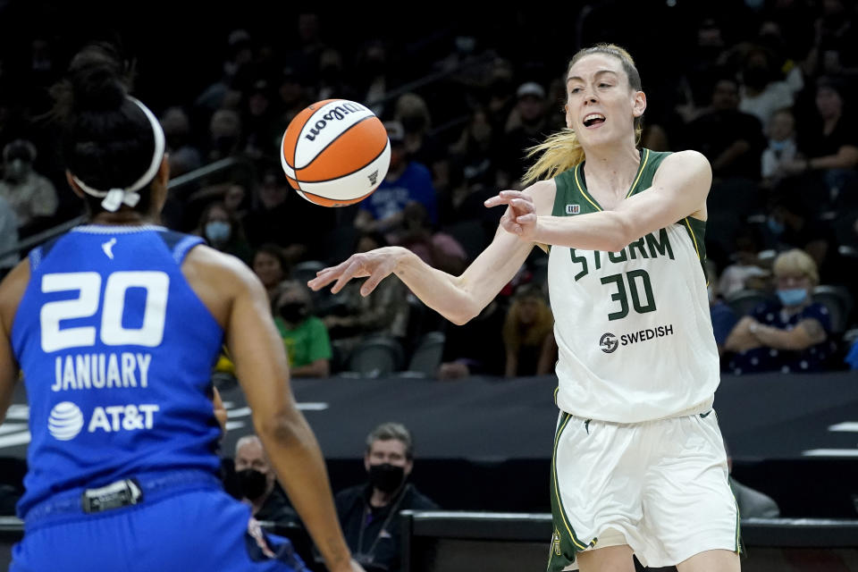 Seattle Storm forward Breanna Stewart (30) passes the ball as Connecticut Sun guard Briann January (20) defends during the first half of the Commissioner's Cup WNBA basketball game, Thursday, Aug. 12, 2021, in Phoenix. (AP Photo/Matt York)