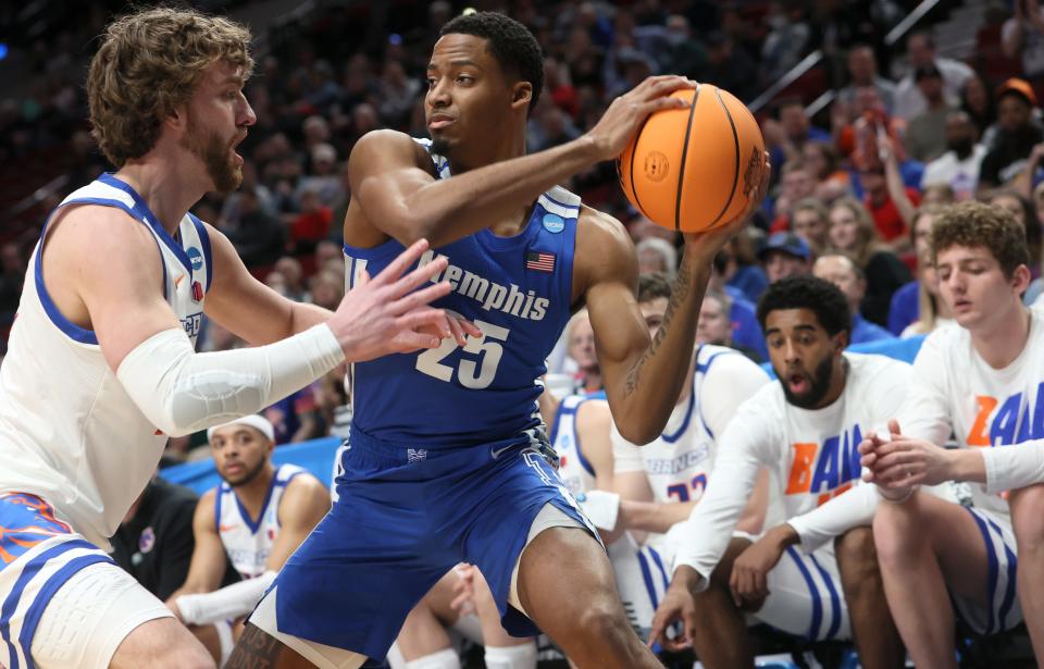 Memphis Tigers guard Jayden Hardaway is defended by Boise State Broncos guard Max Rice during their first round NCAA Tournament matchup on Thursday, March 17, 2022 at the Moda Center in Portland, Ore.