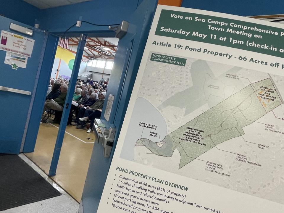 A display outside the auditorium at Stony Brook Elementary School in Brewster, where voters gathered for the annual town meeting on May 11, outlines some of the plans for the former Sea Camps that were up for voter consideration.
