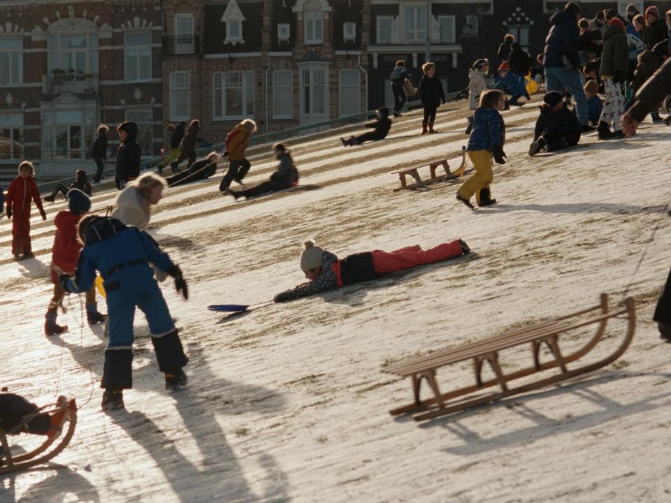 Children sledding in Amsterdam