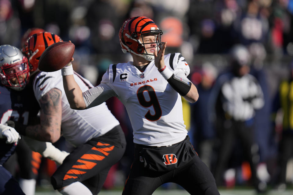 Cincinnati Bengals quarterback Joe Burrow (9) winds up to pass during the first half of an NFL football game against the New England Patriots, Saturday, Dec. 24, 2022, in Foxborough, Mass. (AP Photo/Charles Krupa)