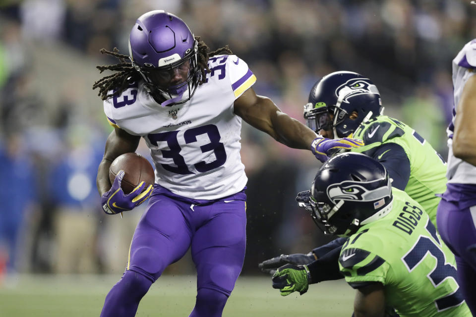 Minnesota Vikings' Dalvin Cook (33) carries against the Seattle Seahawks during the first half of an NFL football game, Monday, Dec. 2, 2019, in Seattle. (AP Photo/John Froschauer)