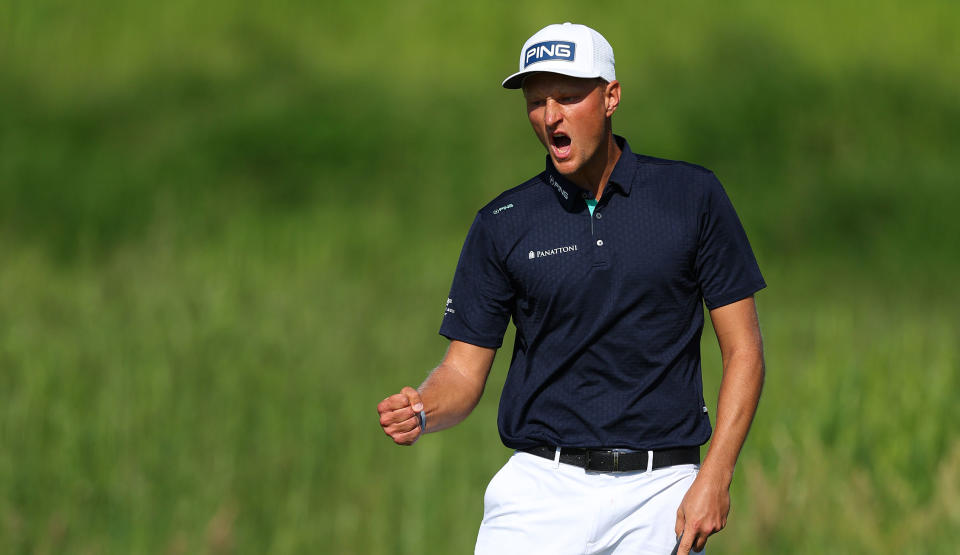   Meronk shouts and fist pumps after holing a putt 