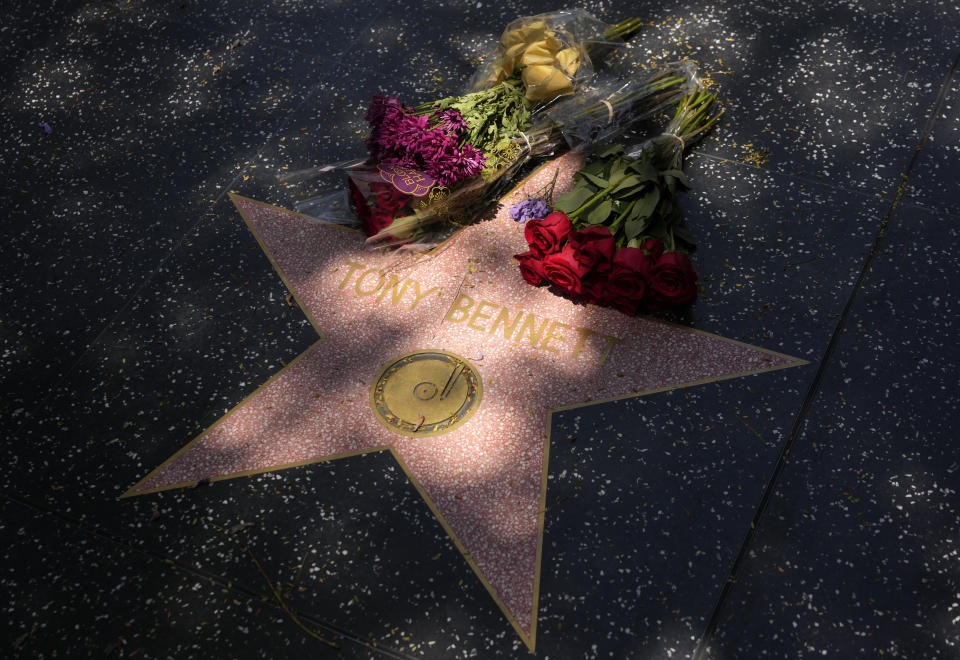 Flowers lay atop the Hollywood Walk of Fame star of the late singer Tony Bennett, Friday, July 21, 2023, in Los Angeles. Bennett died Friday at 96, just two weeks short of his birthday. (AP Photo/Chris Pizzello)