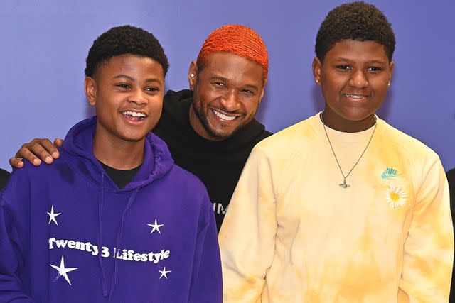 <p>Paras Griffin/Getty Images</p> Usher with Cinco and Naviyd