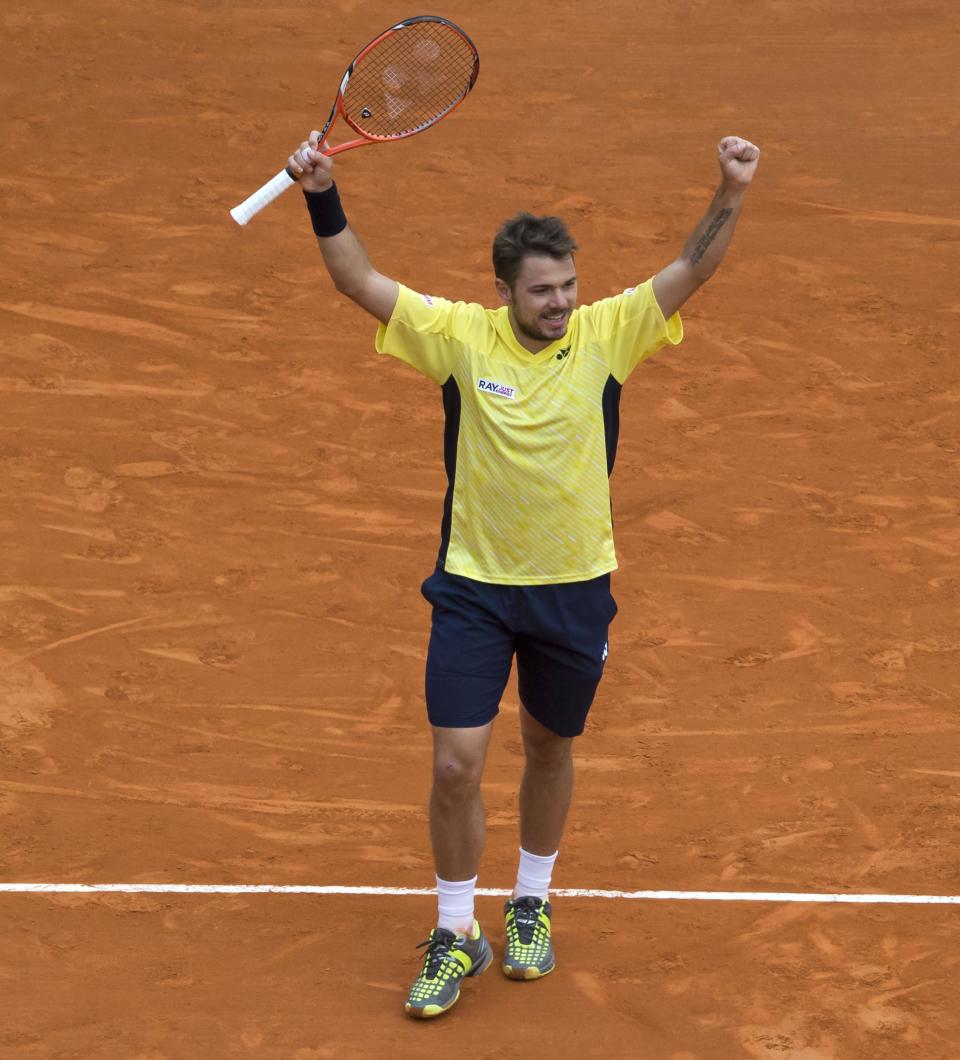 Stanislas Wawrinka of Switzerland, celebrates after defeating David Ferrer of Spain during their semifinal match of the Monte Carlo Tennis Masters tournament in Monaco, Saturday, April 19, 2014. Wawrinka won 6-1 7-6. (AP Photo/Michel Euler)