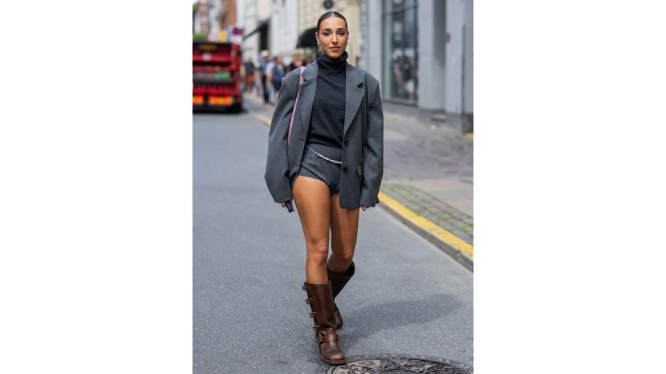 Ginevra Mavilla wearing grey shorts paired with an oversized blazer and turtleneck.