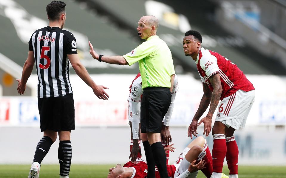 Fabian Schar gets his marching orders after a heavy tackle on Gabriel Martinelli - GETTY IMAGES