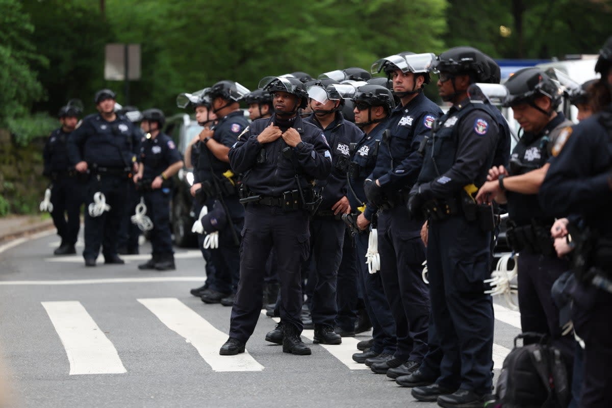 Police watch pro-Palestinian demonstrators near the Met Gala at the Metropolitan Museum of Art on May 6, 2024 in New York (AFP via Getty Images)
