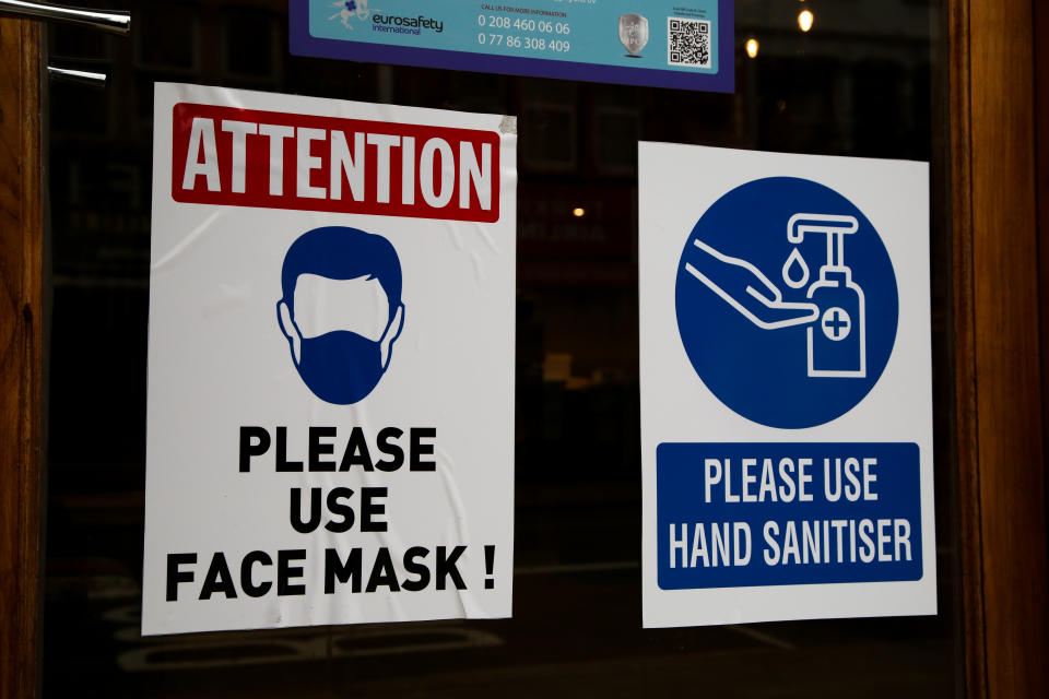 LONDON, UNITED KINGDOM - 2021/02/22: Signs on a window of a restaurant asking people to wear face masks and use hand sanitizer during coronavirus breakout.
Over 19 million people have received at least one dose of the coronavirus vaccine in the UK and 700,000 have received their second dose. (Photo by Dinendra Haria/SOPA Images/LightRocket via Getty Images)