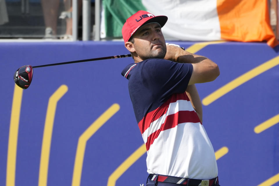 United States' Scottie Scheffler tees off the 1st tee during his singles match at the Ryder Cup golf tournament at the Marco Simone Golf Club in Guidonia Montecelio, Italy, Sunday, Oct. 1, 2023. (AP Photo/Alessandra Tarantino)