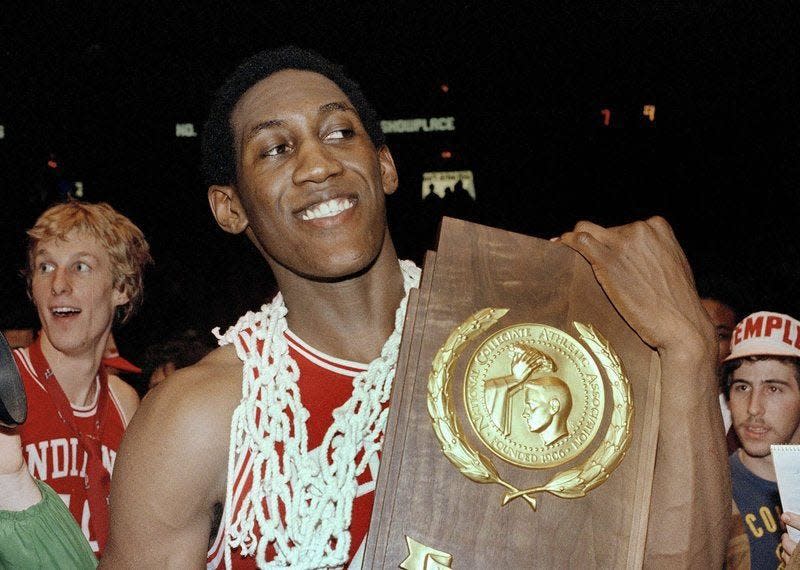 Indiana’s Ray Tolbert cradles the NCAA championship trophy following the Hoosiers’ 63-50 win over North Carolina in the 1981 championship game in Philadelphia.