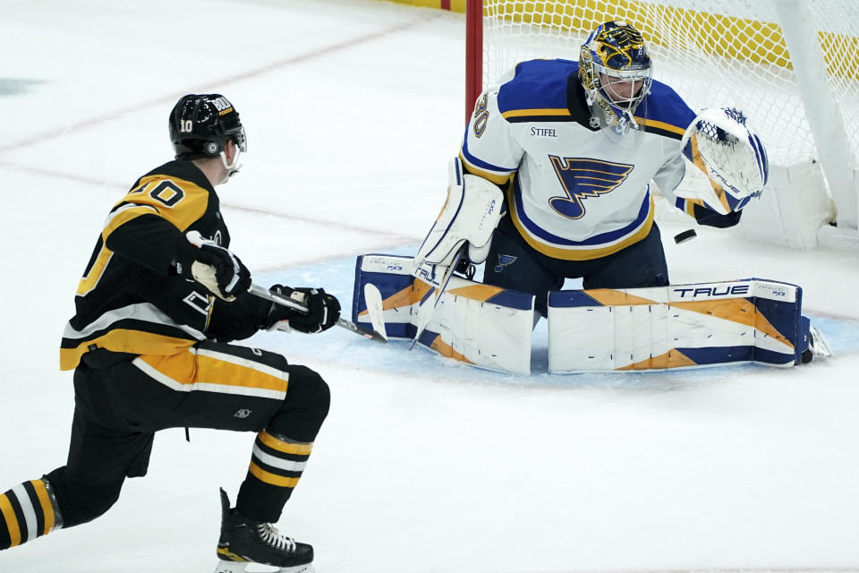 Pittsburgh Penguins' Drew O'Connor (10) scores against St. Louis Blues goaltender Joel Hofer (30) during the first period of an NHL hockey game Saturday, Dec. 30, 2023, in Pittsburgh. (AP Photo/Matt Freed)
