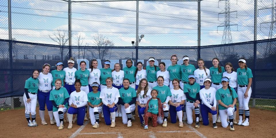 The John Jay-East Fishkill and Mahopac softball teams pose together, clad in Morgan's Message "Mental Health Matters" T-shirts, before their April 24, 2023 game. John Jay dedicated the contest to raising awareness for mental health among athletes.