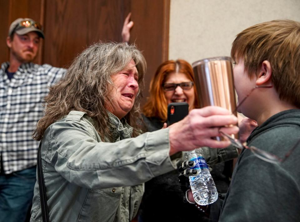 Tammy Graham, Gavin Sumner’s grandmother, embraces him after he picked up a water bottle at the Montgomery County Historic Courthouse in Clarksville, Tenn., on Dec. 23.