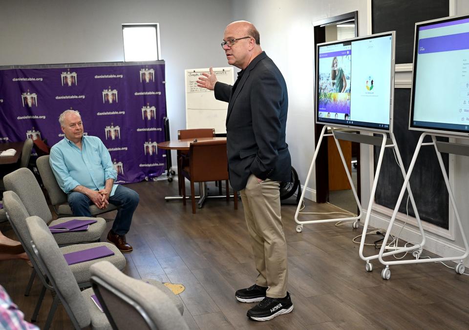 U.S. Rep. Jim McGovern, D-Worcester, right, speaks during his visit to Daniel's Table in Framingham, June 28, 2022. At left is Daniel's Table founder David Blais. The discussion centered around food insecurity solutions.