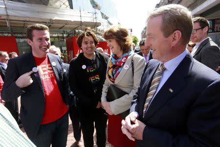 Irish Prime Minister Enda Kenny (R) shares a joke with Yes campaigners in central Dublin in Ireland May 21, 2015. REUTERS/Cathal McNaughton