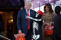 <p>President Donald Trump (L) and first lady Melania Trump host Halloween at the White House on the South Lawn Oct. 30, 2017 in Washington, D.C. The first couple gave cookies away to costumed trick-or-treaters one day before the Halloween holiday. (Photo: Chip Somodevilla/Getty Images) </p>
