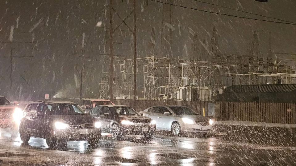 Snow falls in Amarillo on Thursday as a winter storm system passes through the area.