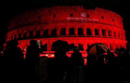 The Colosseum is lit up in red to draw attention to the persecution of Christians around the world in Rome, Italy, February 24, 2018. REUTERS/Remo Casilli