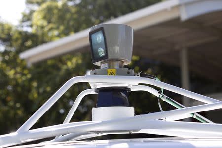 A sensor is seen spinning atop a Google self-driving vehicle before a presentation at the Computer History Museum in Mountain View, California in this May 13, 2014 file photo. REUTERS/Stephen Lam/Files