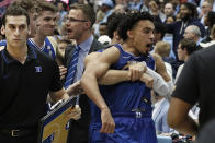Duke guard Tre Jones is congratulated by guard Jordan Goldwire following Jones' shot to force overtime against North Carolina during the second half of an NCAA college basketball game in Chapel Hill, N.C., Saturday, Feb. 8, 2020. (AP Photo/Gerry Broome)