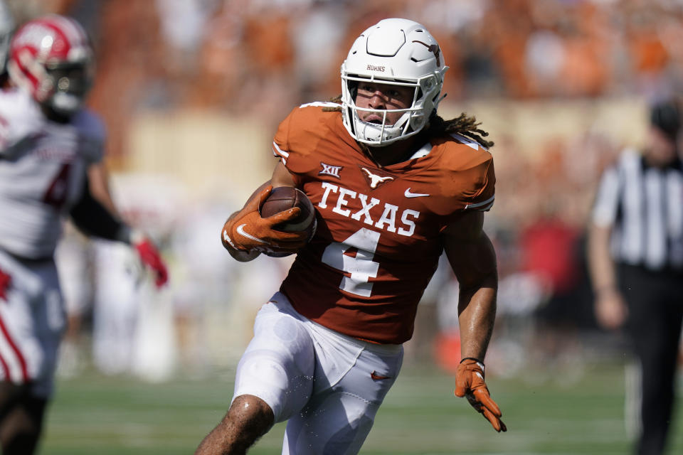 Texas wide receiver Jordan Whittington (4) runs upfield against Louisiana-Lafayette after making a catch during the first half of an NCAA college football game, Saturday, Sept. 4, 2021, in Austin, Texas. (AP Photo/Eric Gay)