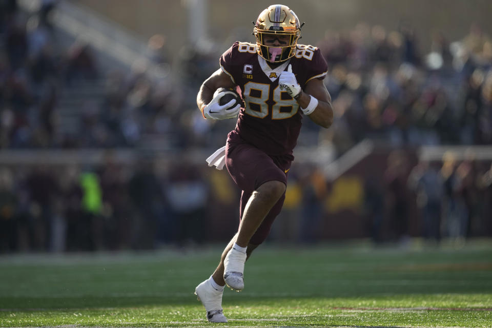 Minnesota tight end Brevyn Spann-Ford (88) runs to score a 31-yard touchdown during the first half of an NCAA college football game against Illinois, Saturday, Nov. 4, 2023, in Minneapolis. (AP Photo/Abbie Parr)