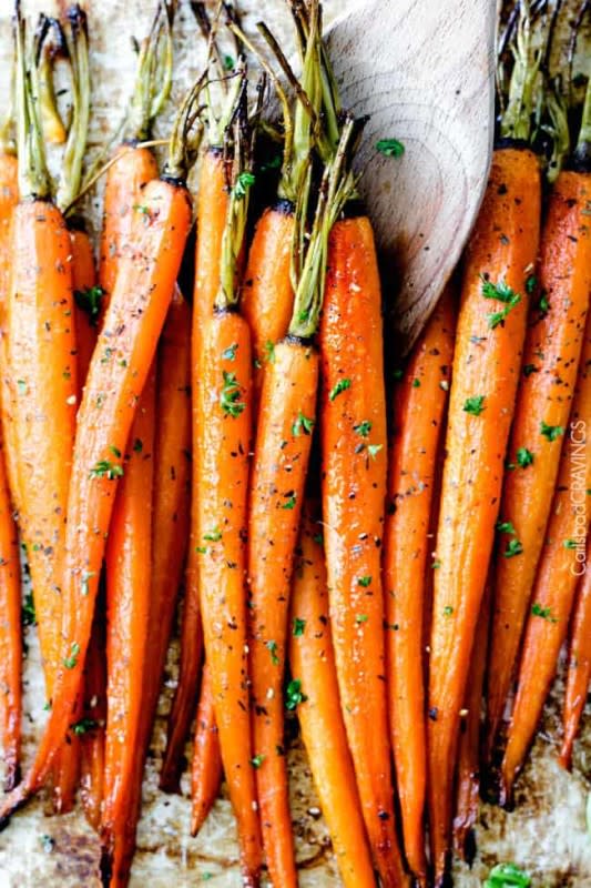 <p>Carlsbad Cravings</p><p>Roasted carrots infused with honey and garlic that are tender, sweet and savory and hands down the easiest side dish ever with only 10 minutes prep!</p><p><strong>Get the recipe: <a href="https://carlsbadcravings.com/honey-garlic-roasted-carrots/" rel="nofollow noopener" target="_blank" data-ylk="slk:Honey Garlic Roasted Carrots;elm:context_link;itc:0;sec:content-canvas" class="link ">Honey Garlic Roasted Carrots</a></strong></p>