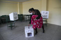 A woman votes during a runoff presidential election in Quito, Ecuador, Sunday, April 11, 2021. (AP Photo/Dolores Ochoa)