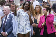 Venus Williams takes a photo standing between U.S. tennis legend Billie Jean King and Rod Laver during a 100 years of Centre Court celebration on day seven of the Wimbledon tennis championships in London, Sunday, July 3, 2022. (AP Photo/Kirsty Wigglesworth)