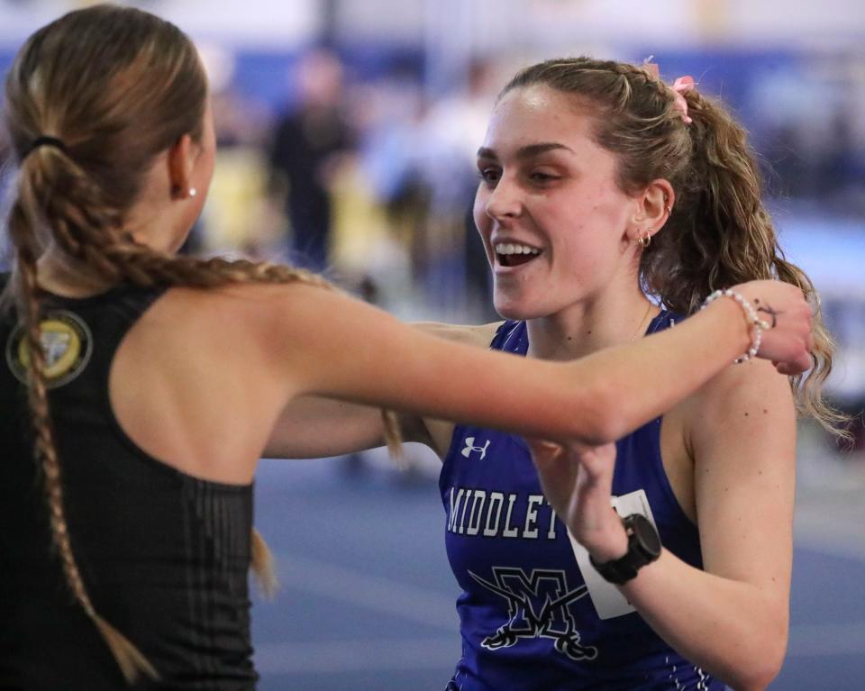Middletown's Isabelle Walsh greets fellow competitor Anna Bockius after Walsh won the 1600 meter race during the DIAA indoor track and field championships at the Prince George's Sports and Learning Complex in Landover, Md., Saturday, Feb. 3, 2024.