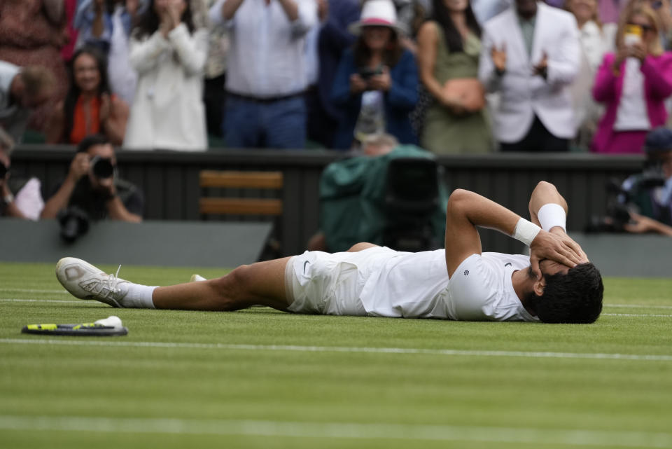 Spain's Carlos Alcaraz celebrates after beating Serbia's Novak Djokovic to win the final of the men's singles on day fourteen of the Wimbledon tennis championships in London, Sunday, July 16, 2023. (AP Photo/Kirsty Wigglesworth)