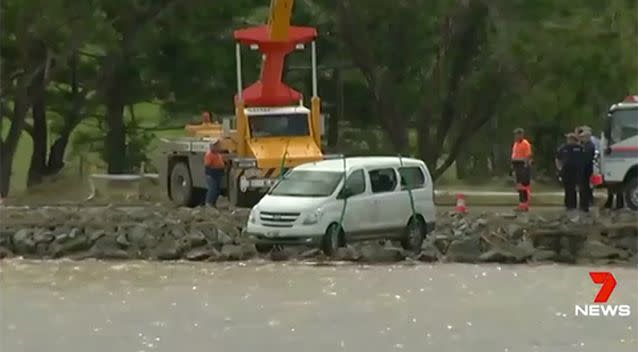 The family's van slid off a muddy road and plunged into the Tweed River. Picture: 7 News