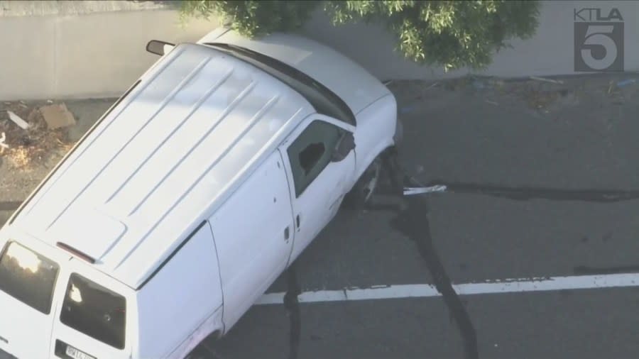 Seveal non-lethal rounds were fired into the van's passenger side window on the 91 Freeway. (KTLA)