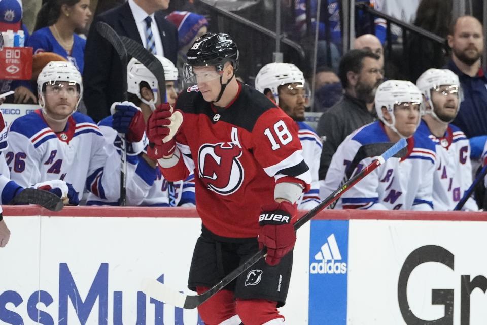 New Jersey Devils' Ondrej Palat (18) skates past the New York Rangers' bench after scoring a goal during the first period of Game 5 of an NHL hockey Stanley Cup first-round playoff series Thursday, April 27, 2023, in Newark, N.J. (AP Photo/Frank Franklin II)