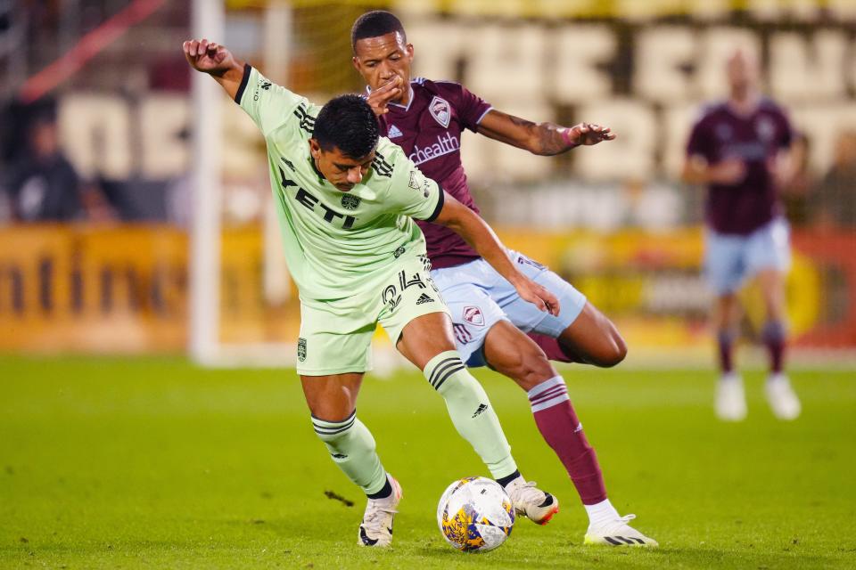 Austin FC defender Nick Lima and Colorado Rapids forward Rafael Navarro battle for the ball in the second half of the Rapids' 1-0 win Saturday night. El Tree has two home matches this week at Q2 Stadium.