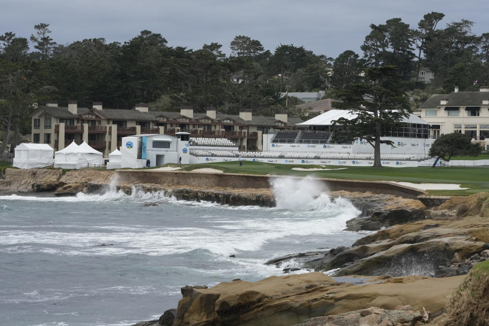 Waves crash against the sea wall along the 18th hole of the Pebble Beach Golf Links during a practice round of the AT&T Pebble Beach National Pro-Am golf tournament in Pebble Beach, Calif., Wednesday, Jan. 31, 2024. (AP Photo/Eric Risberg)