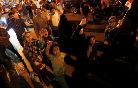 Small groups of protesters gather shouting anti-government slogans in central Cairo