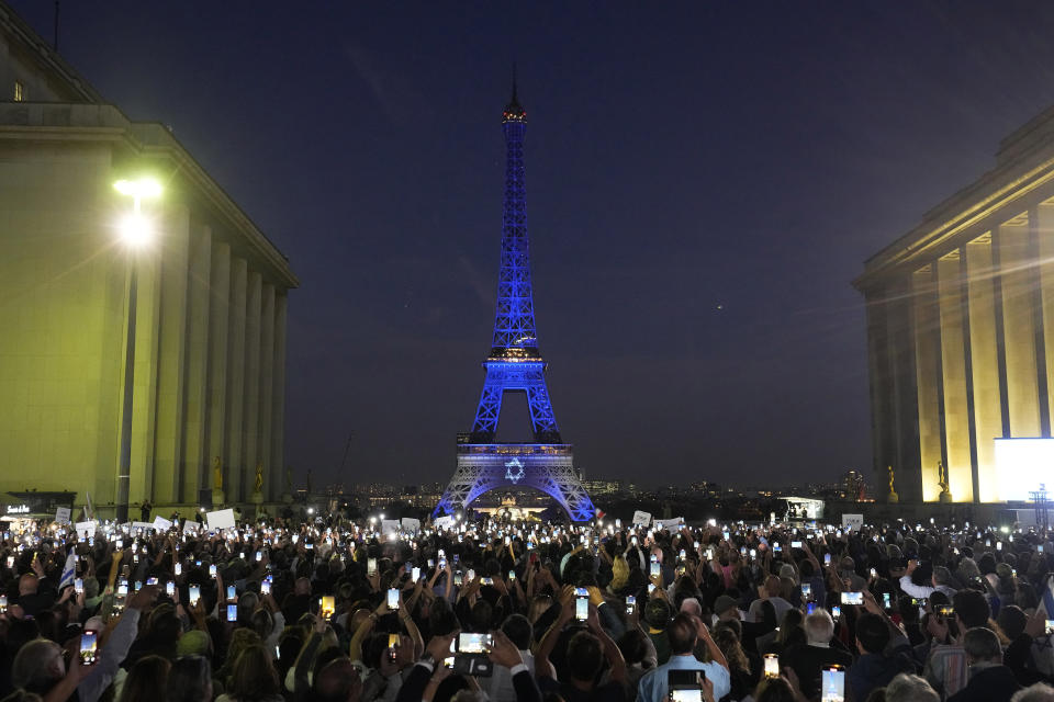 The Eiffel Tower is illuminated with the colors of Israel after a demonstration in a show of support for Israel, Monday, Oct. 9, 2023 in Paris, two days after Hamas fighters launched a multi-front attack on Israel. (AP Photo/Michel Euler, File)