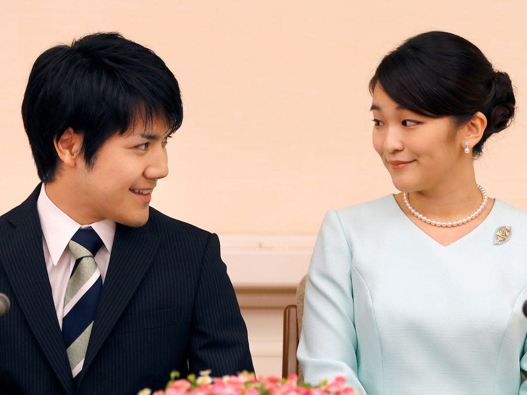 Princess Mako, the elder daughter of Prince Akishino and Princess Kiko, and her fiancee Kei Komuro, a university friend of Princess Mako, smile during a press conference to announce their engagement at Akasaka East Residence in Tokyo, Japan, September 3, 2017.