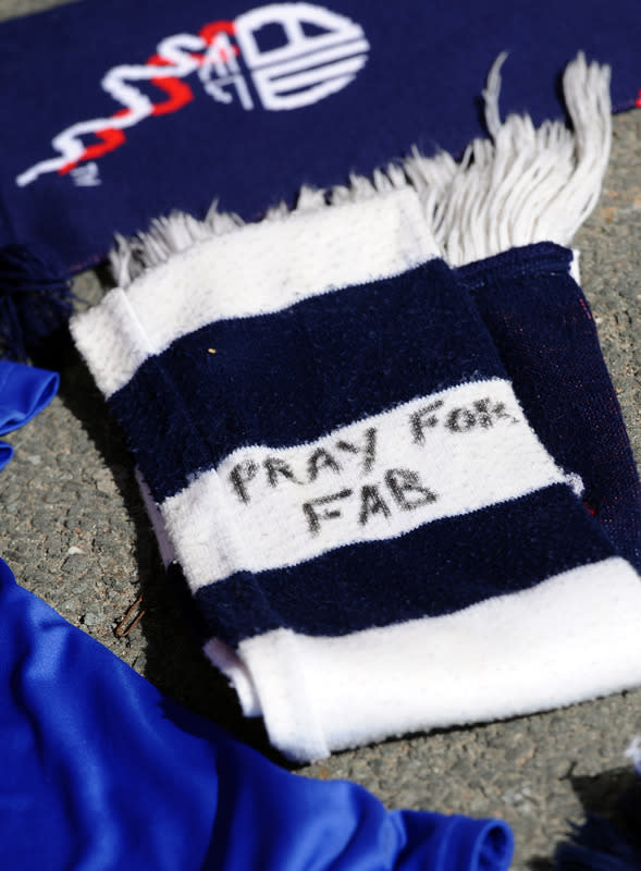 A football scarf with a message of support is left at the stadium's Book of Remembrance at The Reebok Stadium in Bolton, north-west England on March 18, 2012 the morning after Bolton Wanderers' English midfielder Fabrice Muamba collapsed during their FA cup football match against Tottenham Hotspur in London. Muamba remains in 'critical condition' according to the hospital. AFP PHOTO / PAUL ELLIS