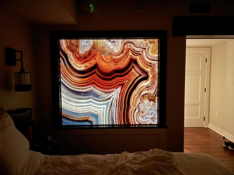 bathroom artwork lit up on the bedroom side in a villa at disney's wilderness lodge