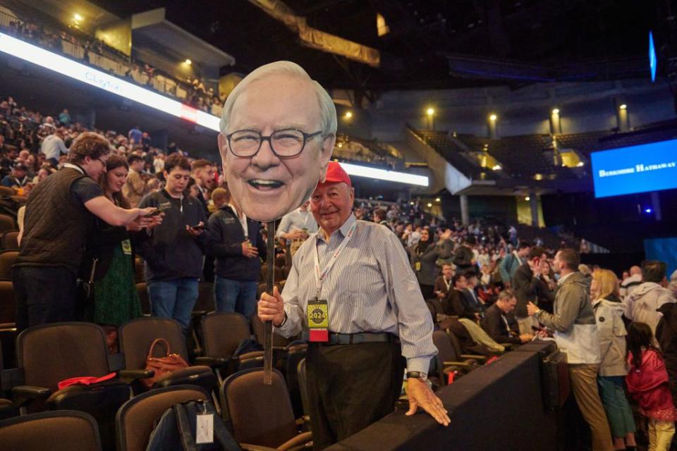 <p>Dan Brouillette/Bloomberg via Getty Images</p> An attendee holds a cardboard cutout of Warren Buffett, chair and CEO of Berkshire Hathaway, during the Berkshire Hathaway annual shareholders meeting in Omaha, Nebraska, on May 4, 2024