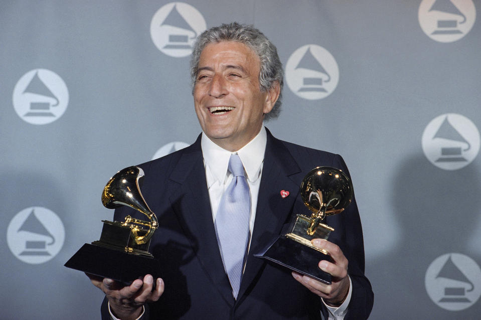 FILE - Veteran singer Tony Bennett displays his two Grammy's backstage at the Shrine Auditorium in Los Angeles Wednesday, March 1, 1995. Bennett, the eminent and timeless stylist whose devotion to classic American songs and knack for creating new standards such as 